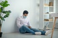 Man sitting on the floor and looking demotivated Royalty Free Stock Photo