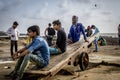 Unemployed people sitting on the street of Mumbai