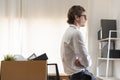 Unemployed, quite job. Desperate caucasian young businessman resigning from company, packing belongings, stuff in box cardboard, Royalty Free Stock Photo