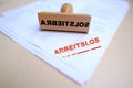 unemployed red rectangular grunge sign in German on documents, red text on white, Wooden vintage hand rubber stamp, concept of