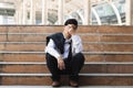 Unemployed stressed young Asian business man suffering from severe depression. Failure and layoff concept Royalty Free Stock Photo