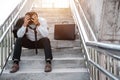 Unemployed stressed young Asian business man in suit covering face with hands. Failure and layoff concept to the disease Covid-19,