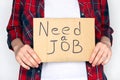 Unemployed woman hold sign need a job