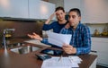 Unemployed young couple with debts reviewing their bank accounts Royalty Free Stock Photo