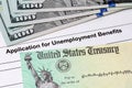 Unemployment benefits application, stimulus check and money.