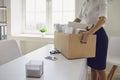 Unemployment Dismissed businesswoman upset with a cardboard box leaves the workplace from the office of the company. Royalty Free Stock Photo