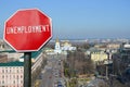 Unemployment sign on Kyiv view background. Financial crash in world economy because of coronavirus. Global economic crisis