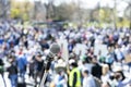 Unemployment strike, protest or anti government public demonstration, blurred protesting crowd in the background Royalty Free Stock Photo