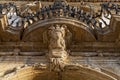 Italy, Sicily, Scicli Ragusa province, the Unesco Baroque Fava Palace facade 18th Century a.C., statue under a balcony