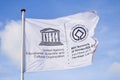 UNESCO white weaving flag, blue sky Royalty Free Stock Photo