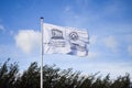 UNESCO white weaving flag, blue sky Royalty Free Stock Photo