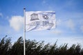 UNESCO white weaving flag, blue sky Royalty Free Stock Photo