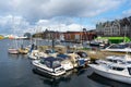 UNESCO WHS Bryggen in the background of Bergen`s port and a lot of boats are parked over there. August 2019