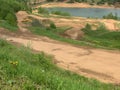 uneven dangerous earthen sand road in nature for motocross