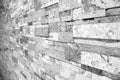 Uneven masonry marble Brick wall in black and white selective focus taken from a side Royalty Free Stock Photo