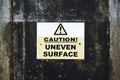 Uneven road surface caution sign in construction building site