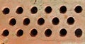 Uneven surface of perforated brick, ribbed textures of brickwork masonry