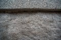 Uneven texture of rough stone wall of gray granite Royalty Free Stock Photo