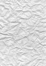 Unevenly crumpled white sheet of stationery paper texture
