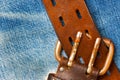 Unfastened old leather belt with vintage buckles