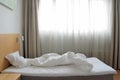Unfilled bed in motel room Royalty Free Stock Photo