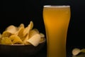Unfiltered beer and potato chips in the bowl Royalty Free Stock Photo