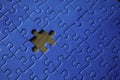 Unfinished blue-piece puzzle with a missing piece Royalty Free Stock Photo