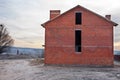 Unfinished brick house construction, still under construction. Unfinished roof under construction