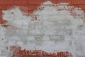 Unfinished cement plastering on red bricks wall texture background Royalty Free Stock Photo