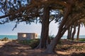 Unfinished clay hut at Gambian beach in sunset