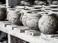 Unfinished clay pots on shelves as part of a ceramic pottery workshop in Marginea, Bucovina, Suceava county, Romania