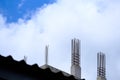 Unfinished concrete column under tower construction with protruded steel reinforcement bar Royalty Free Stock Photo