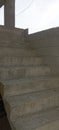 An unfinished concrete staircase in a 2-story building construction Royalty Free Stock Photo