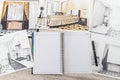 Unfinished  draft of classic room sketch, empty notepad, color tools on desk Royalty Free Stock Photo