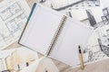 Unfinished  draft of classic room sketch, empty notepad, color tools on desk Royalty Free Stock Photo