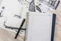 Unfinished  draft of classic room sketch, empty notepad, color tools on desk Royalty Free Stock Photo