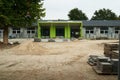 Unfinished green exterior school building Royalty Free Stock Photo