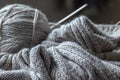 Unfinished grey knitting with ball of wool Royalty Free Stock Photo