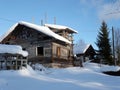 Unfinished house or cottage littered with snow. Scaffolding. Incomplete construction. Build a rural house with your own hands from Royalty Free Stock Photo