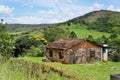 An unfinished house and the hill in the city of AndrelÃ¢ndia in Minas Gerais