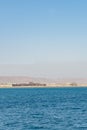 Unfinished houses by the sea. Unfinished buildings of new hotel resort in Egypt. vertical photo