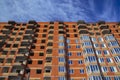 Unfinished huge brick building exterior facade vintage architecture style construction process urban foreshortening from below