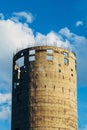 Unfinished industrial elevator. Round concrete tower with protruding pieces of reinforcement Royalty Free Stock Photo