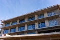 Unfinished modern building under construction with big windows