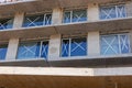 Unfinished modern building under construction with big windows