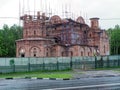 The unfinished Orthodox Church among the trees