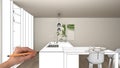 Unfinished project, under construction draft, concept interior design sketch, hand pointing real modern white kitchen with Royalty Free Stock Photo