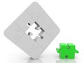 Unfinished puzzle concept in white with a green puzzle piece in the foreground Royalty Free Stock Photo