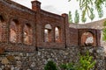 Unfinished red brick construction, old and textured stone. Large oval openings for the Windows, Royalty Free Stock Photo