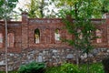 Unfinished red brick construction, old and textured stone. Large oval openings for the Windows, Royalty Free Stock Photo